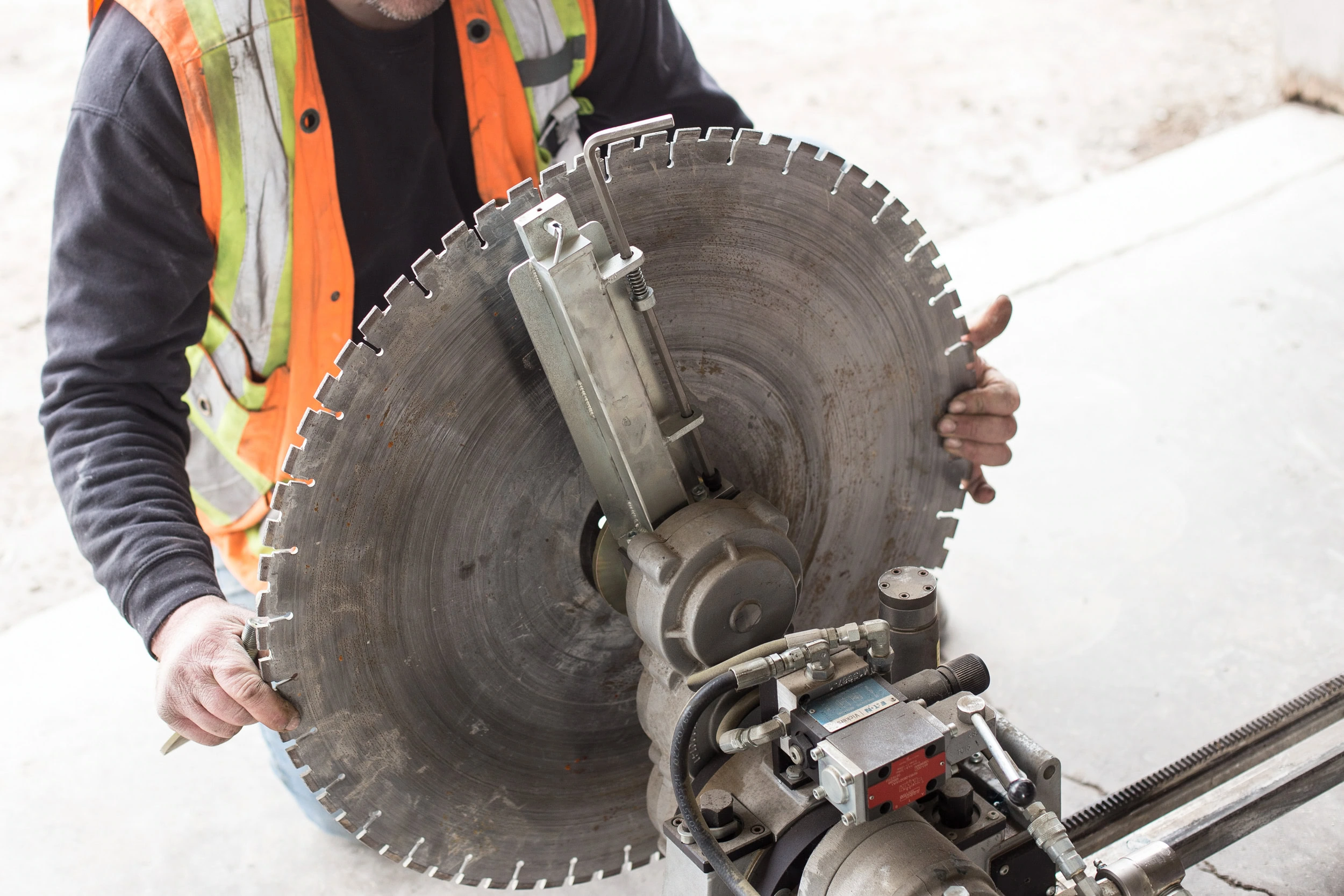 Concrete core drilling a clean round hole on a CDS job site in Hamilton
